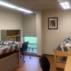 Room with two beds, and two desks
