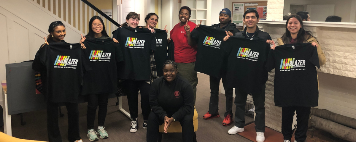 Students pose with shirts that read "Trail Blazer"