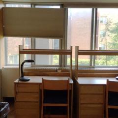 View of two desks facing out over a window